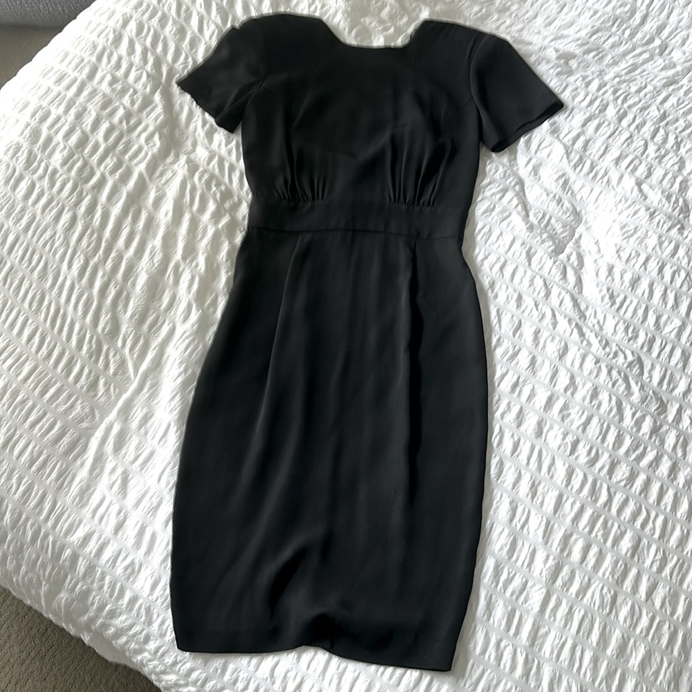 Beautiful low back, short sleeve, button back  little black dress.